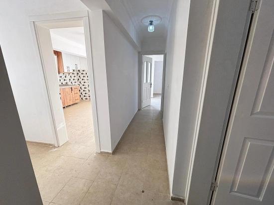 2+1 Apartment For Sale In Seferihisar Ürkmez With Separate Kitchen And Garden, No Expenses