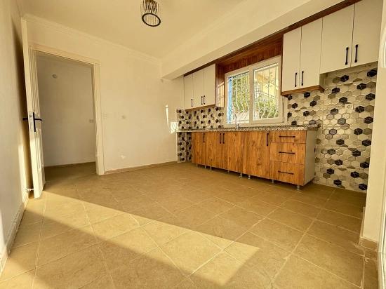 2+1 Apartment For Sale In Seferihisar Ürkmez With Separate Kitchen And Garden, No Expenses