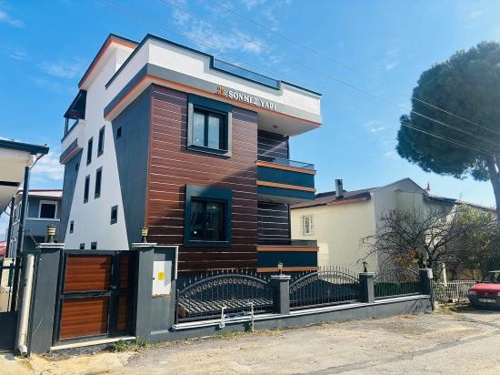 Seferihisar Doğanbey'de Deniz Manzaralı Kat Mülkiyetli 4+1 Satılık Villa